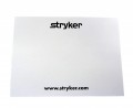 White sticky notepad with black Stryker logo at top and website at bottom. 25 sheets with top sticky strip back, 3